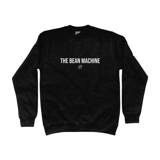 Zwarte barista trui met de tekst 'The Bean Machine' op de borst – stijlvolle sweater voor koffieliefhebbers en professionele barista's.